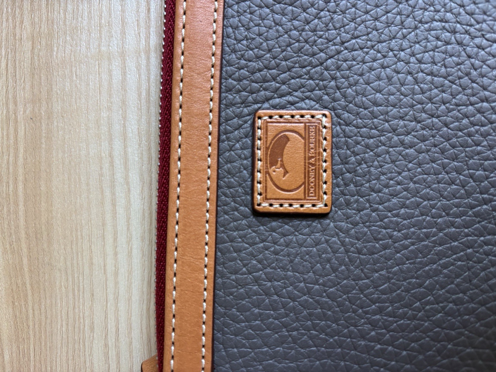 Dooney & Bourke Pebbled Zip Top mini bag with Brown Tan Detachable Strap Tassel