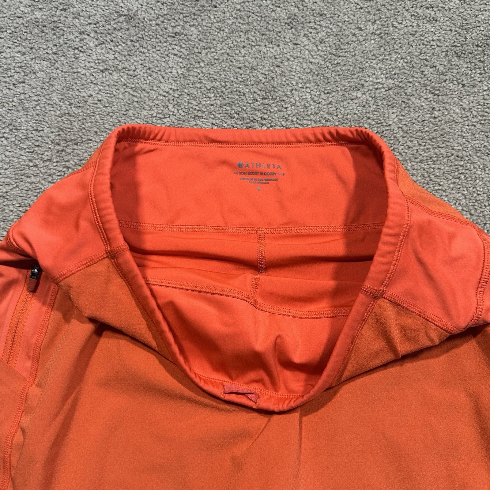 ATHLETA Action Skort in Dobby 14.5 Womens Small Orange Pockets Stretch Athletic