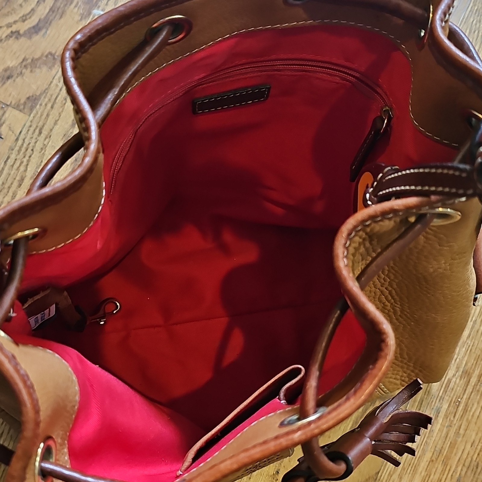 Dooney & Bourke Tan Pebbled Leather Drawstring Bucket Bag Tassel Shoulder Purse
