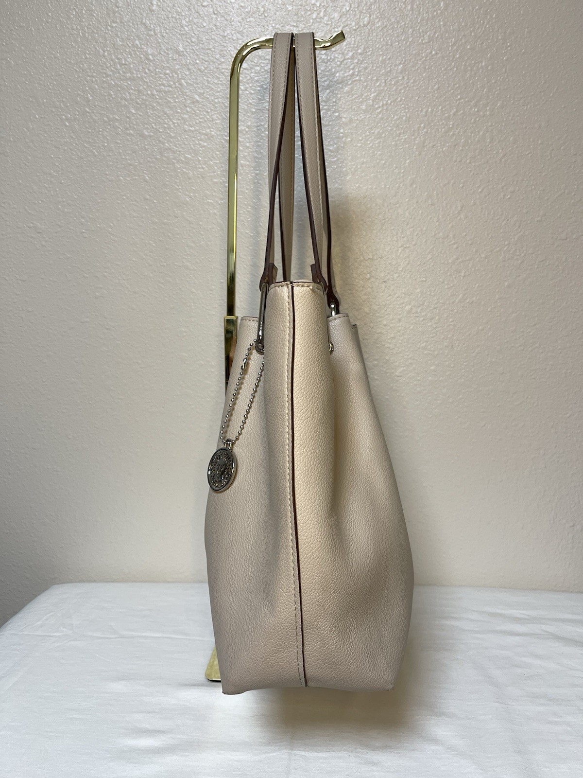 Anne Klein Taupe Vegan Pebbled Texture Tote with Lion and Tassel Charms
