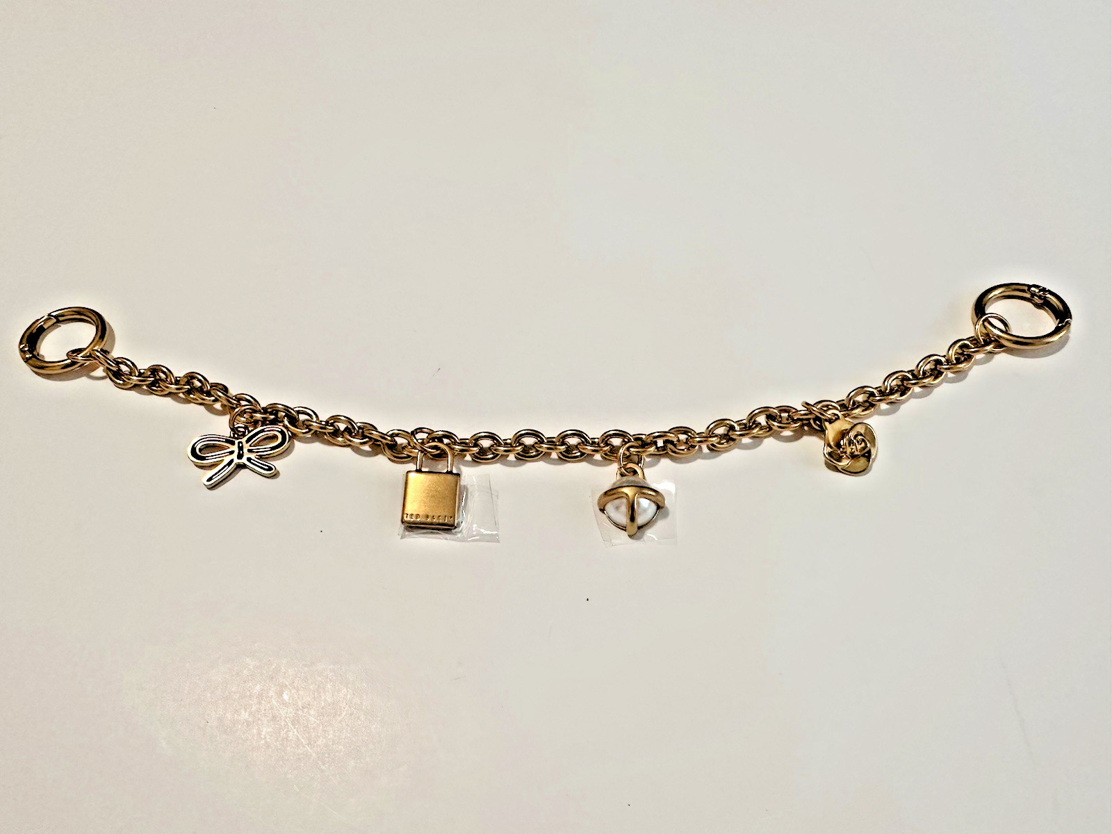 @@ NEW Ted Baker London Logo Gold Brass HandBag Purse Charm Chain Pearl Lock Bow