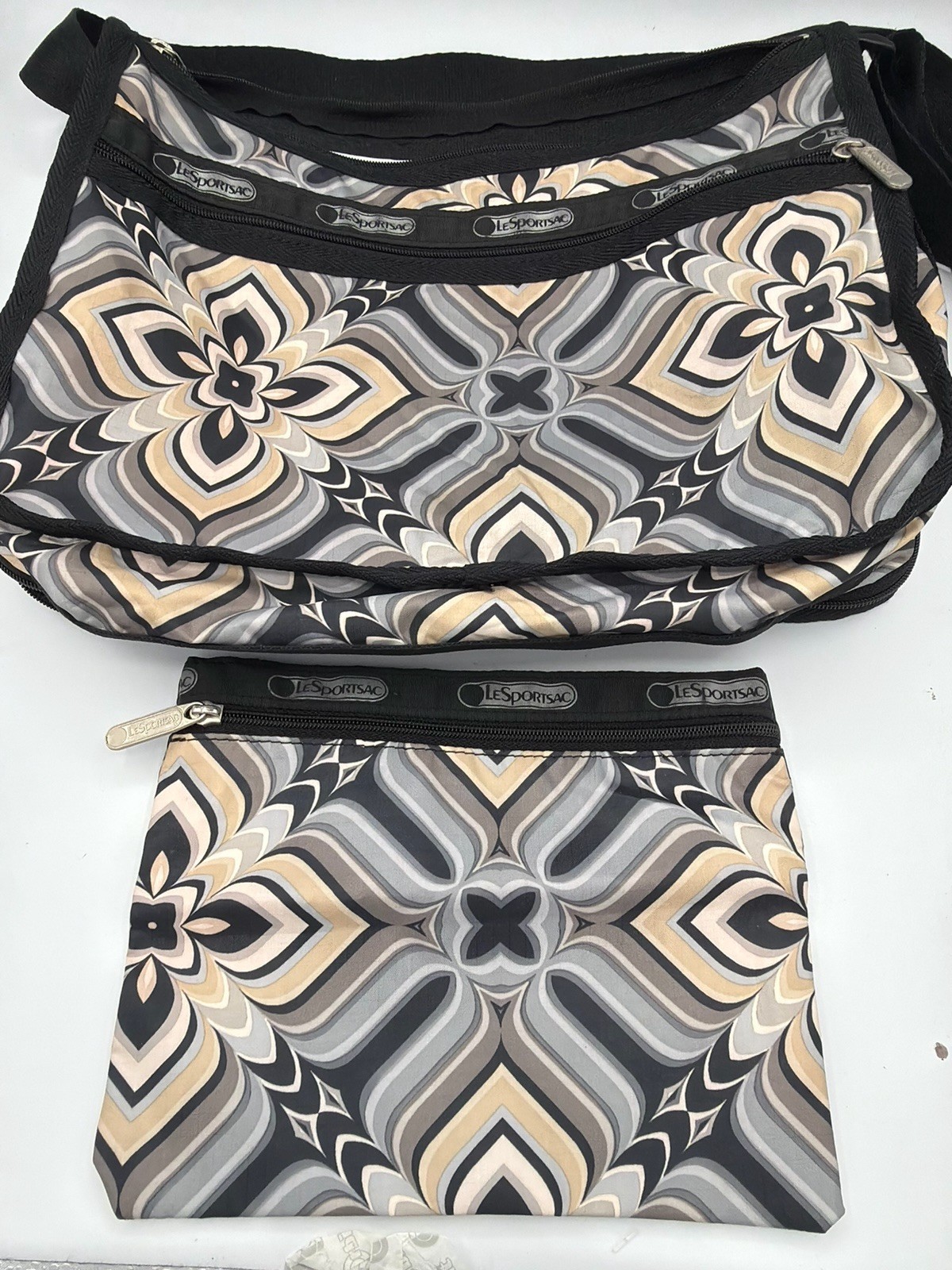 LeSportsac Black/Beige/White Floral expanding Crossbody Bag w/matching pouch