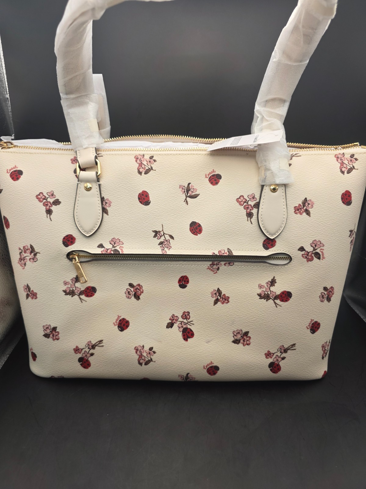 NEW COACH GALLERY TOTE WITH LADYBUG FLORAL PRINT (SCUFF MARKS BACK)