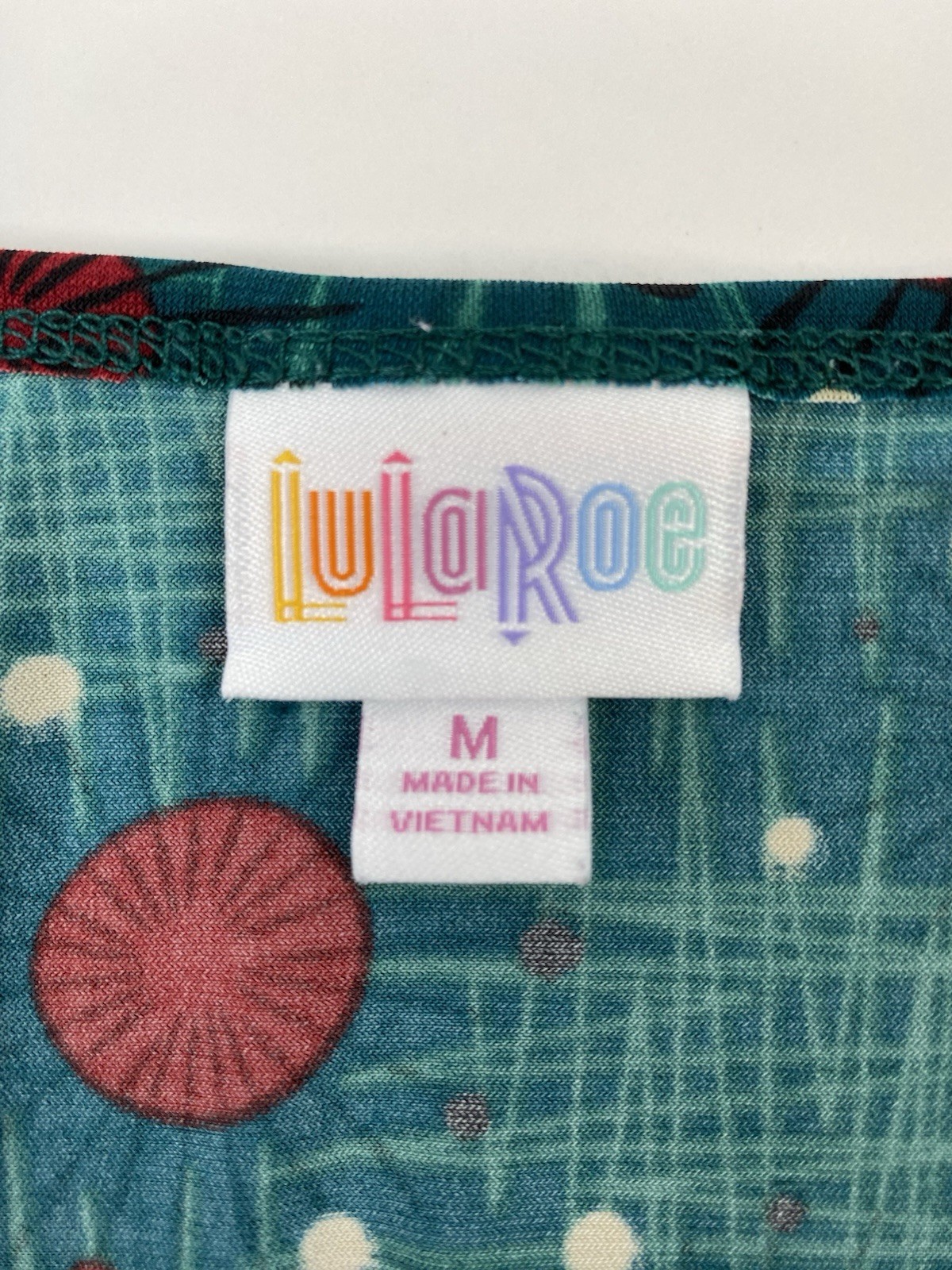 LulaRoe women’s stretch short sleeve green top hi-low measures 3X (see pictures)