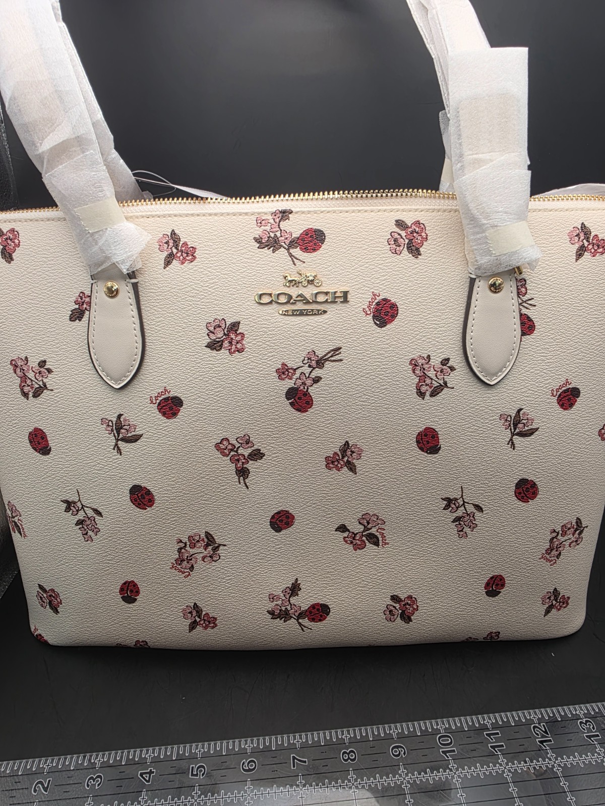 NEW COACH GALLERY TOTE WITH LADYBUG FLORAL PRINT (SCUFF MARKS BACK)