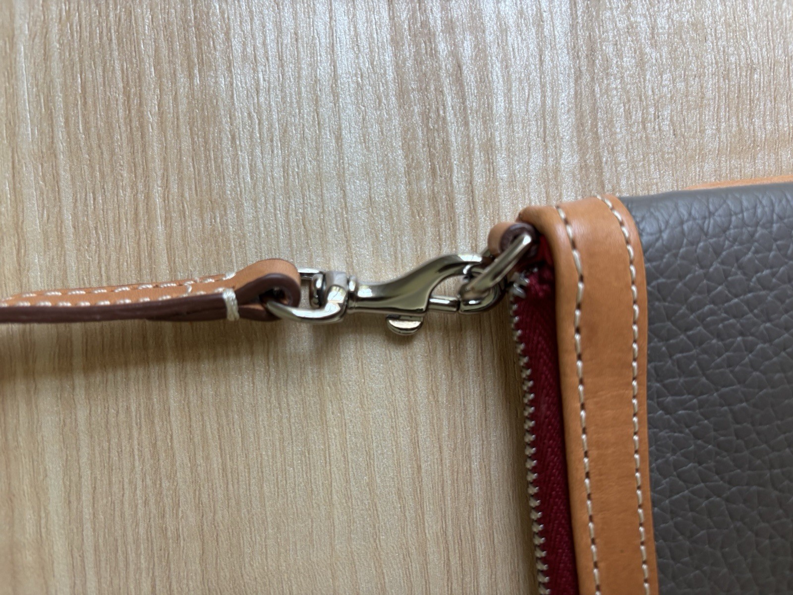 Dooney & Bourke Pebbled Zip Top mini bag with Brown Tan Detachable Strap Tassel
