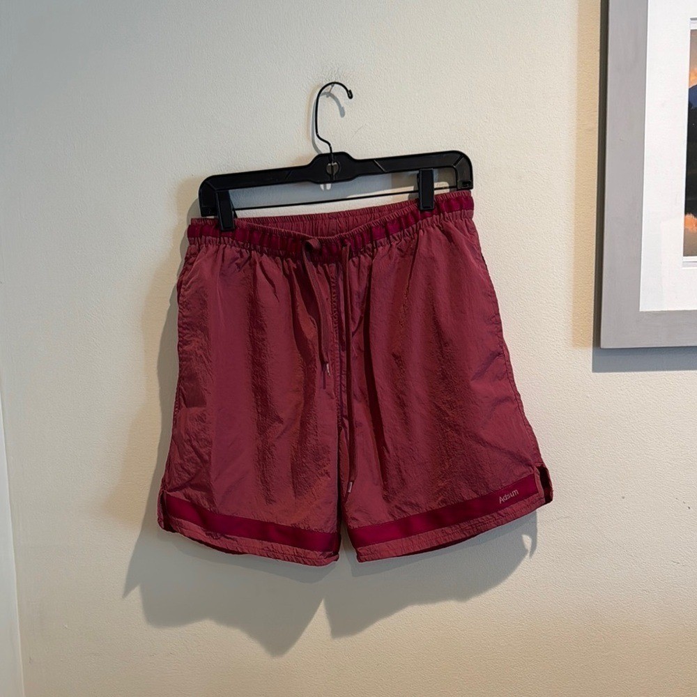 Adsum Effo Nylon Drawstring Shorts in the color raspberry