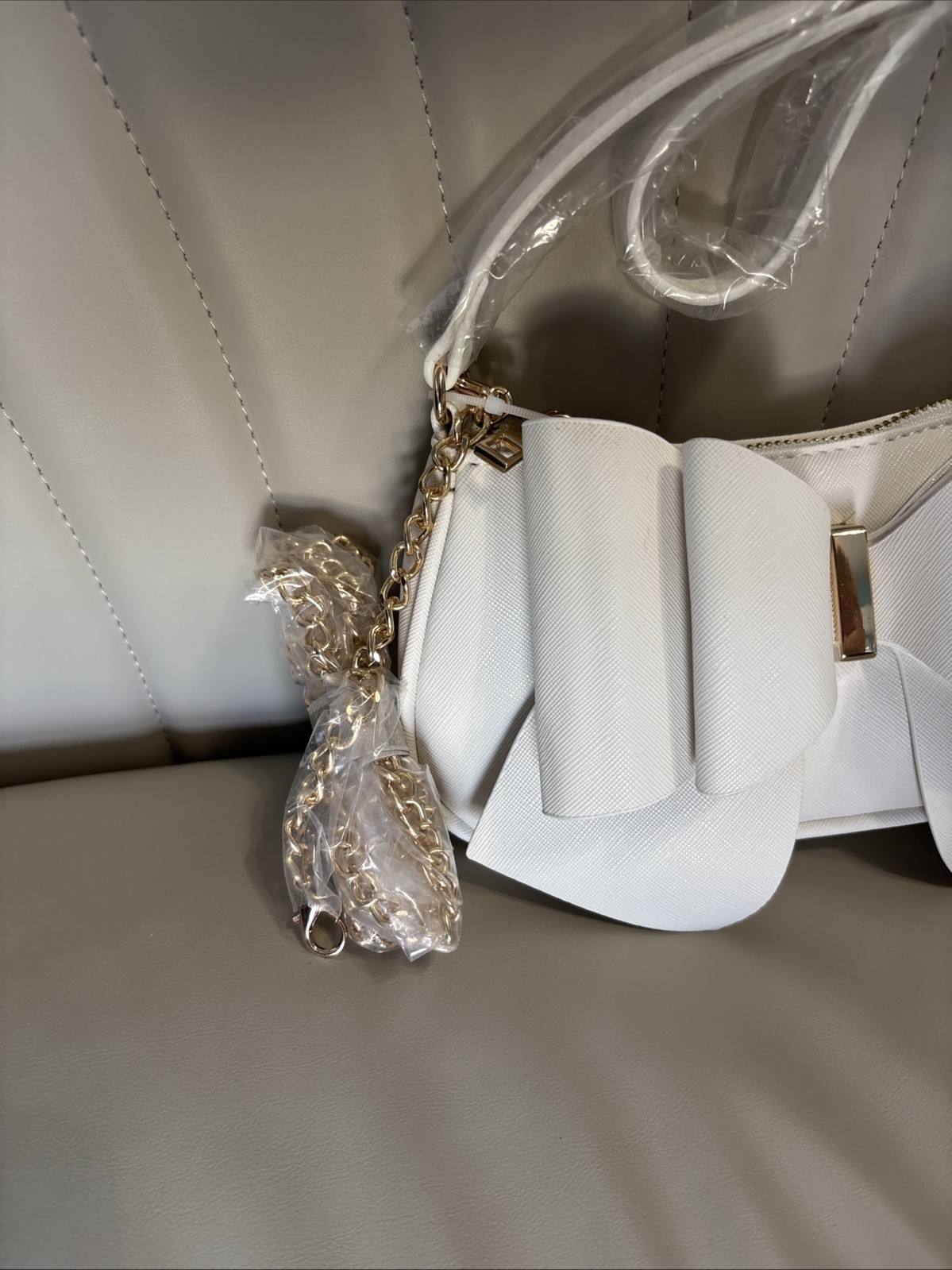 Like Dreams Bowtie Crossbody White Faux Leather Flap Chain Strap Gold Logo