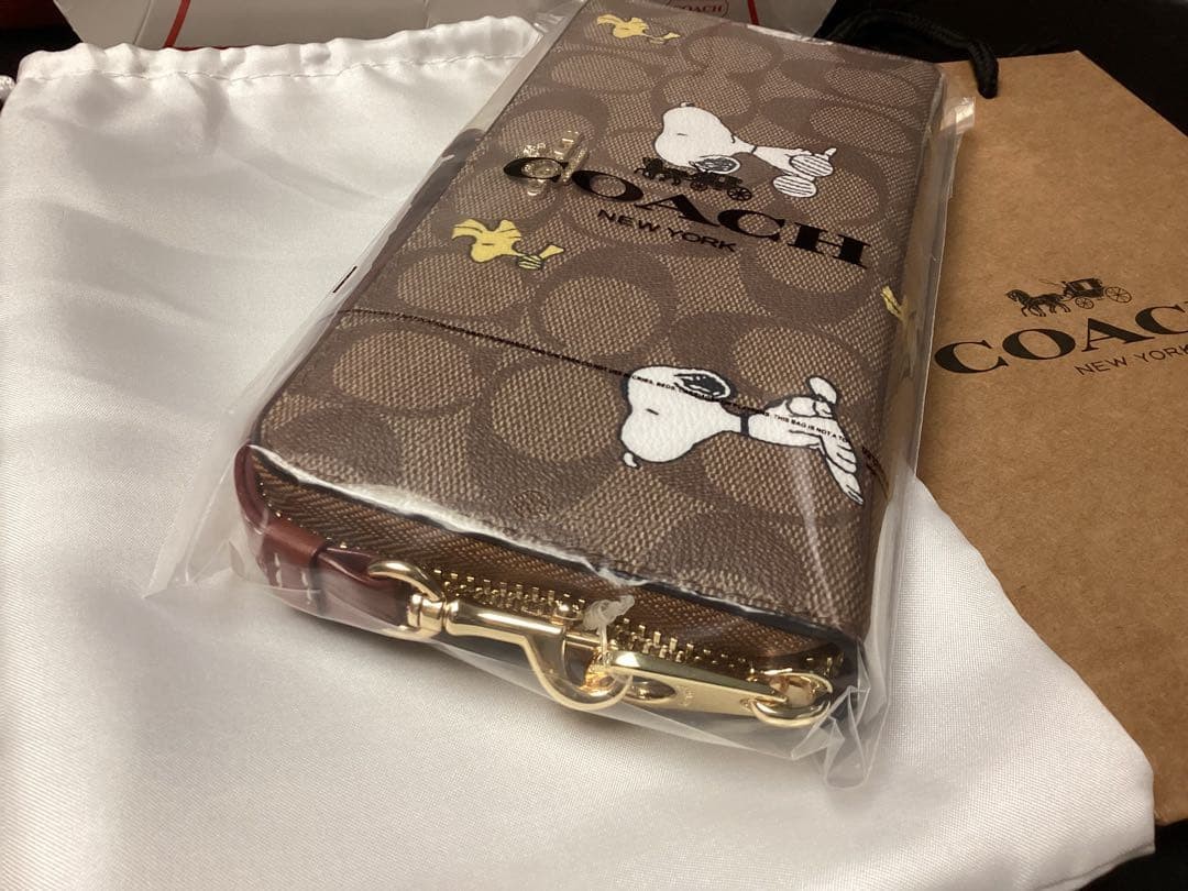 unopened with storage bag COACH long wallet Snoopy collaboration signature auth