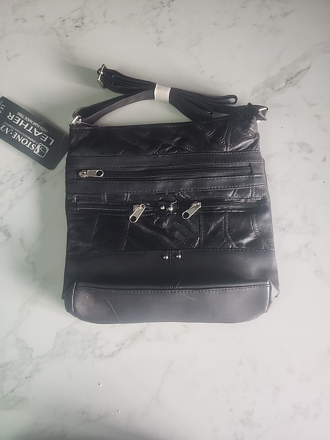 Black solid Stone NY Leather Purse w/ man made trim and over shoulder strap