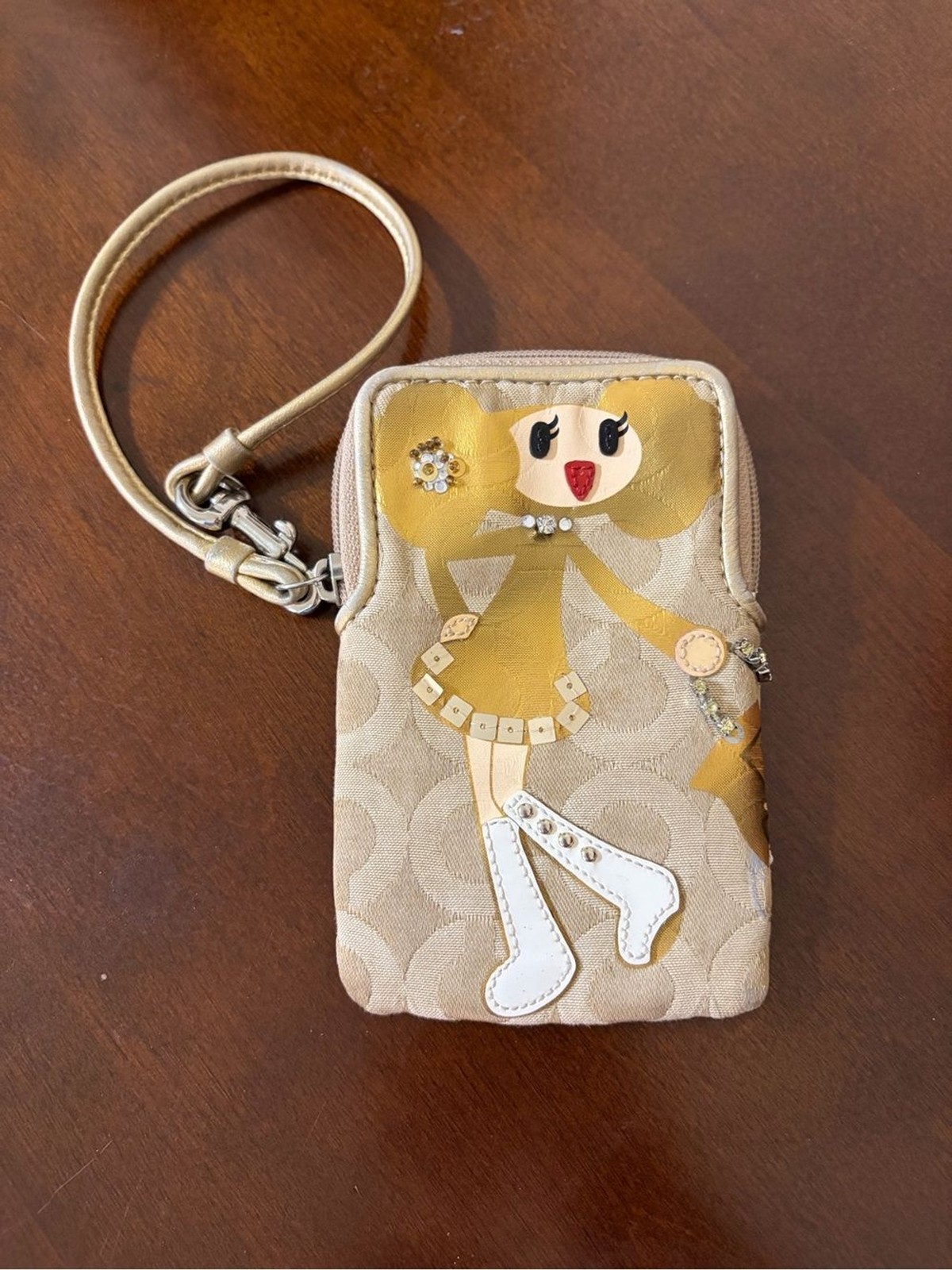 Coach Poppy Chan “Goldy” Small Wristlet Camera Pouch.
