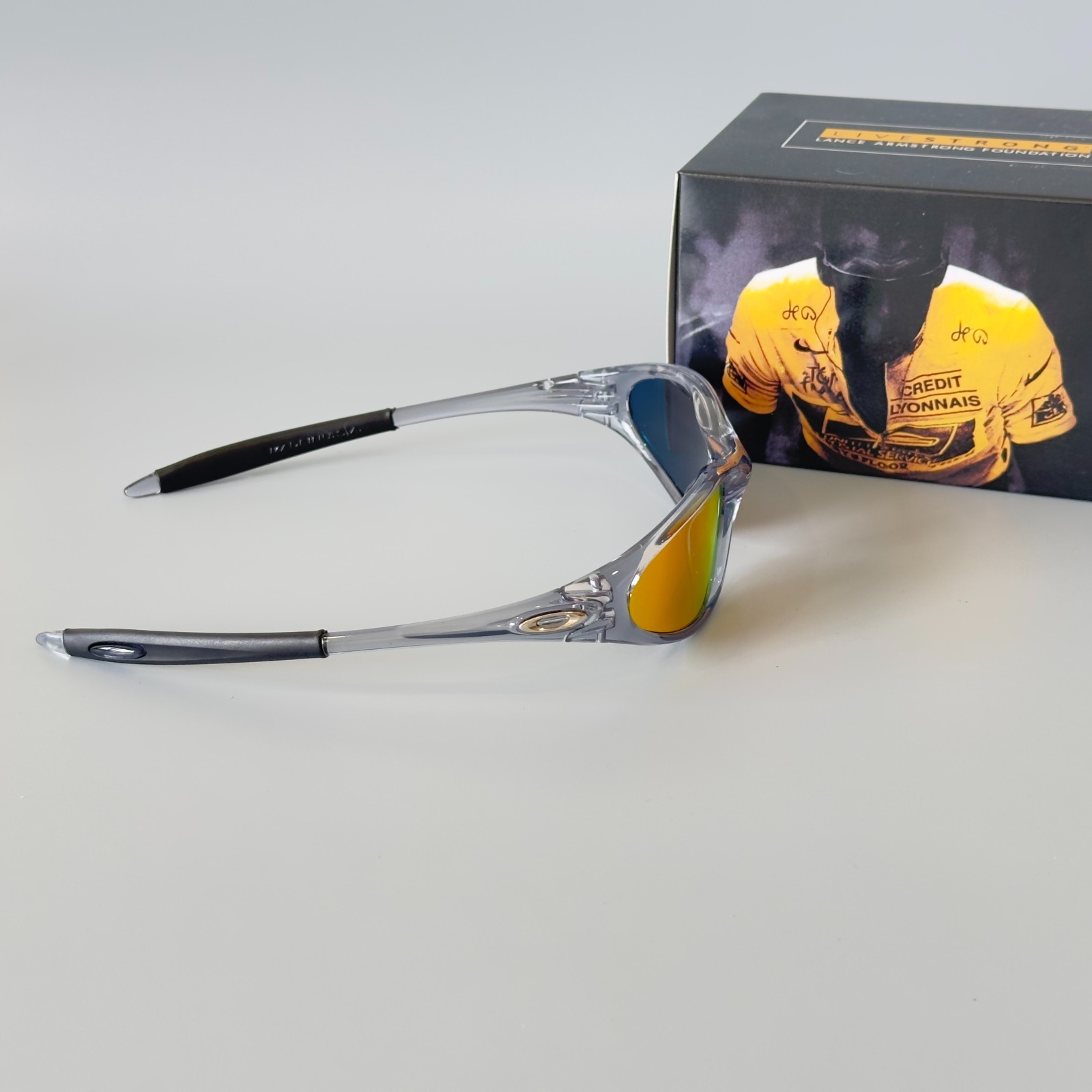 Oakley Minute Gen1 Minute 1.0 Sunglasses Transparent Gray Frame Red Lens