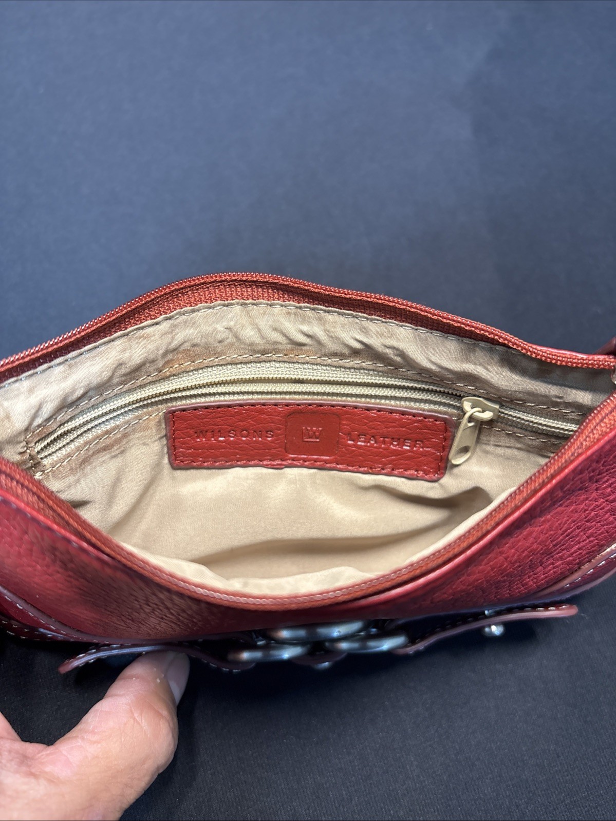 Wilson Leather Red leather buckle accent wristlet