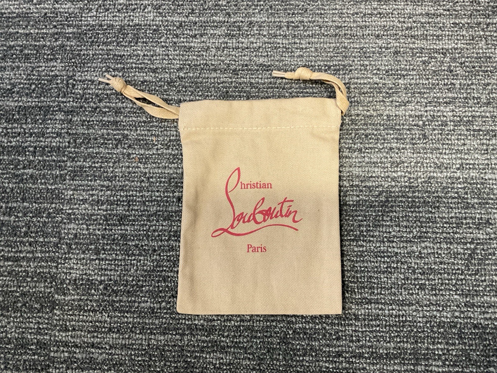 Christian Louboutin tan cloth drawstring pouch 5×6.75′