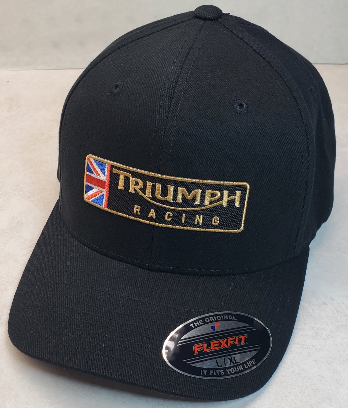 Triumph Racing Emb. Patch Flexfit 6377 Brushed Twill /Black L/XL 7 1/8″ – 7 5/8″