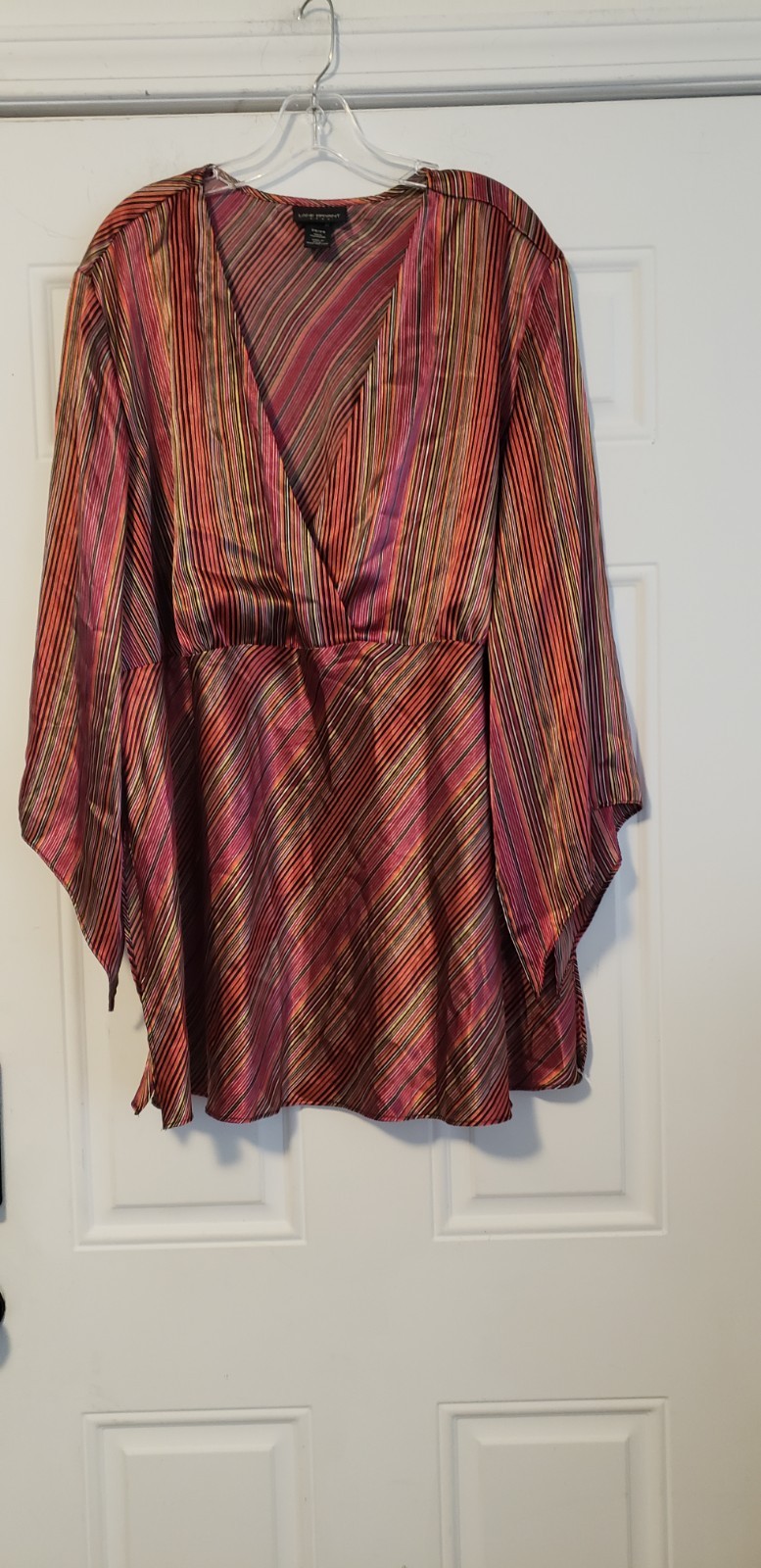 vintage Lane Bryant plus-size satin-look blouse, recognizable by its plunging…