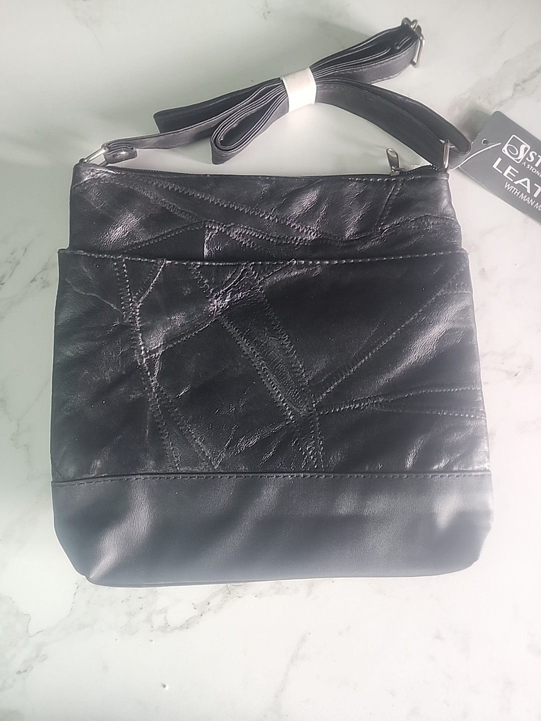 Black solid Stone NY Leather Purse w/ man made trim and over shoulder strap