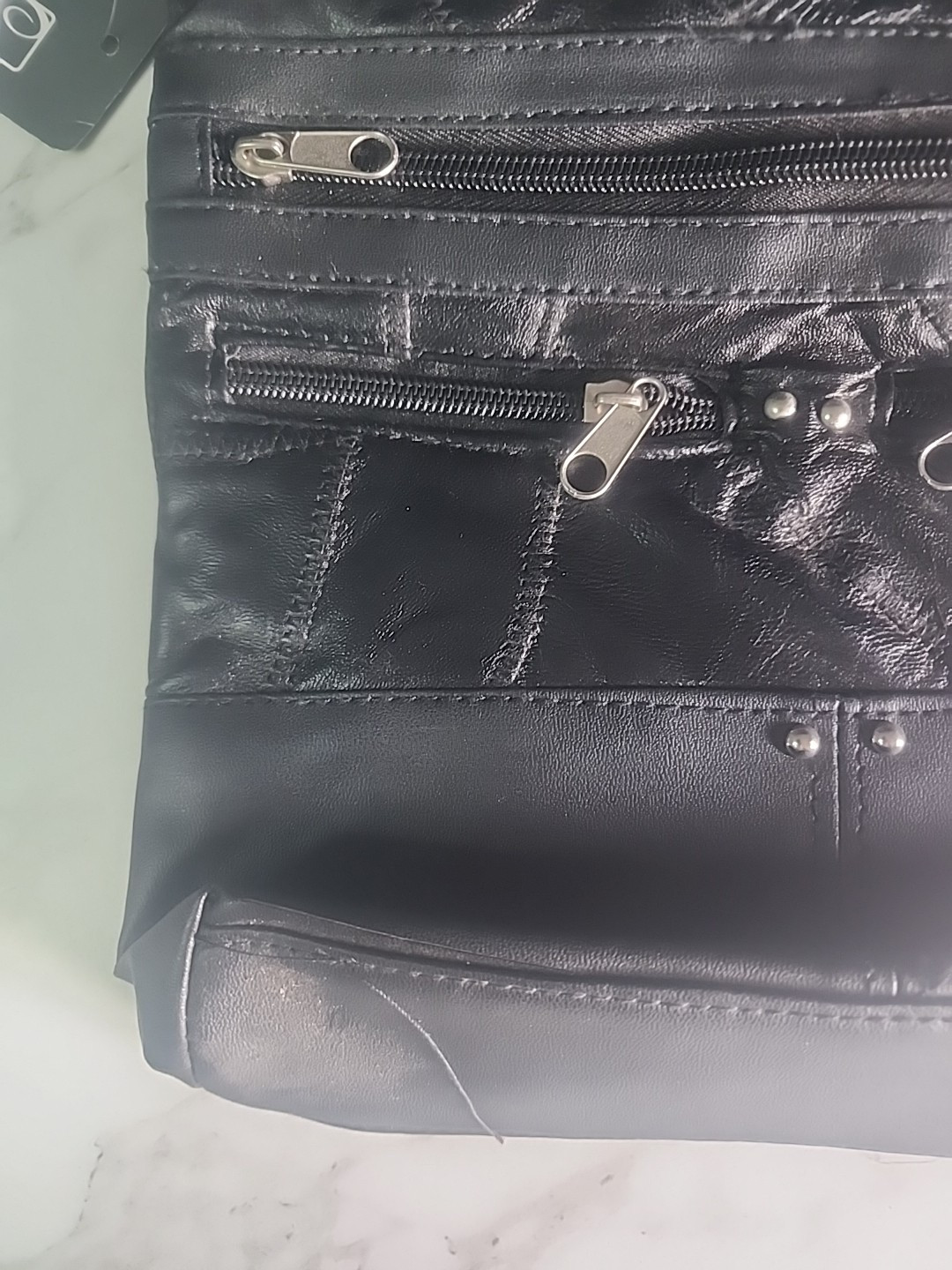 Black solid Stone NY Leather Purse w/ man made trim and over shoulder strap