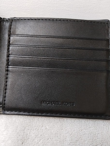MICHAEL KORS black leather mens wallet, good condition, dual bill slots