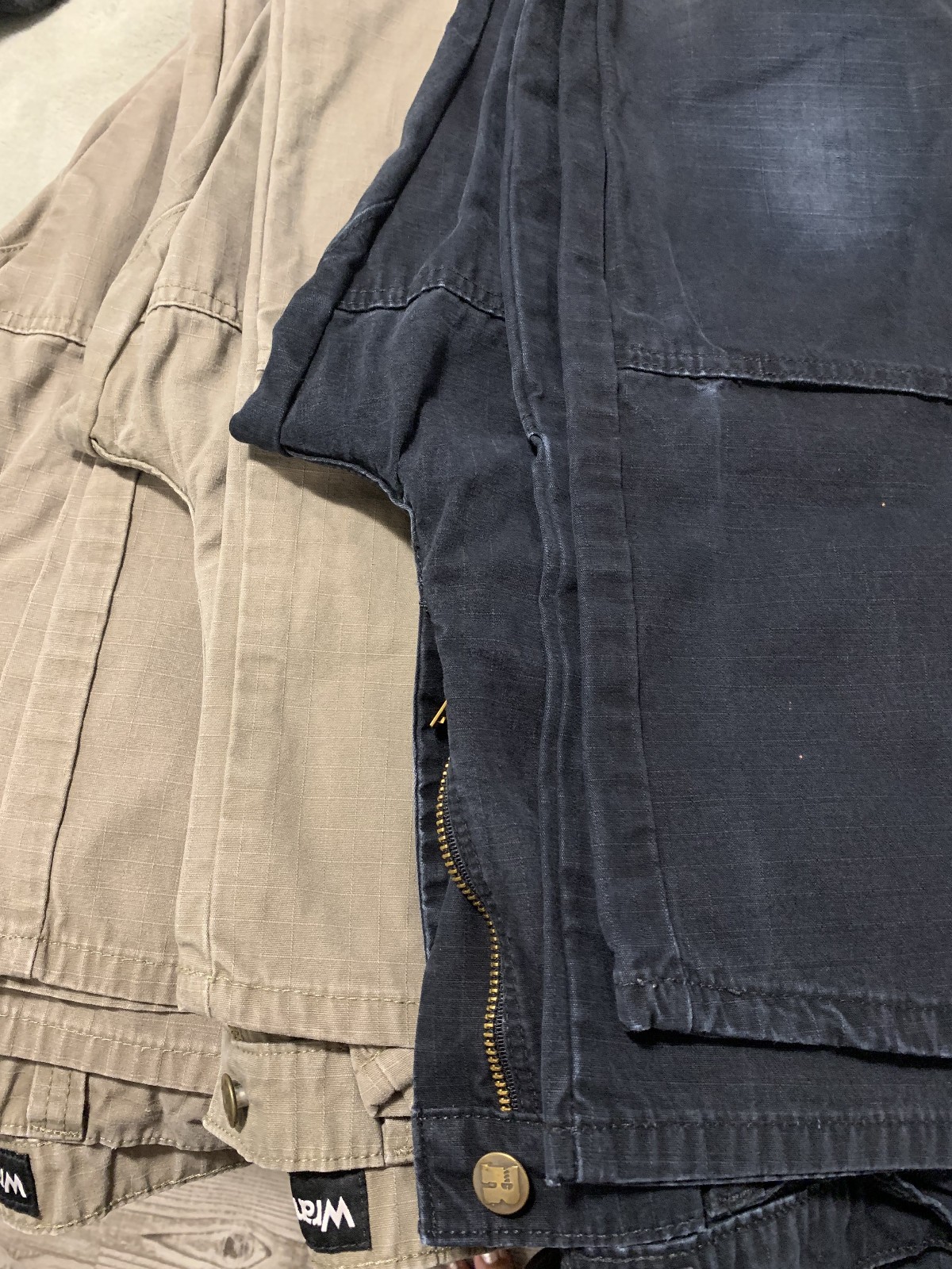 31×32 wrangler riggs workwear pants qty 3 (2 tan and 1 black)