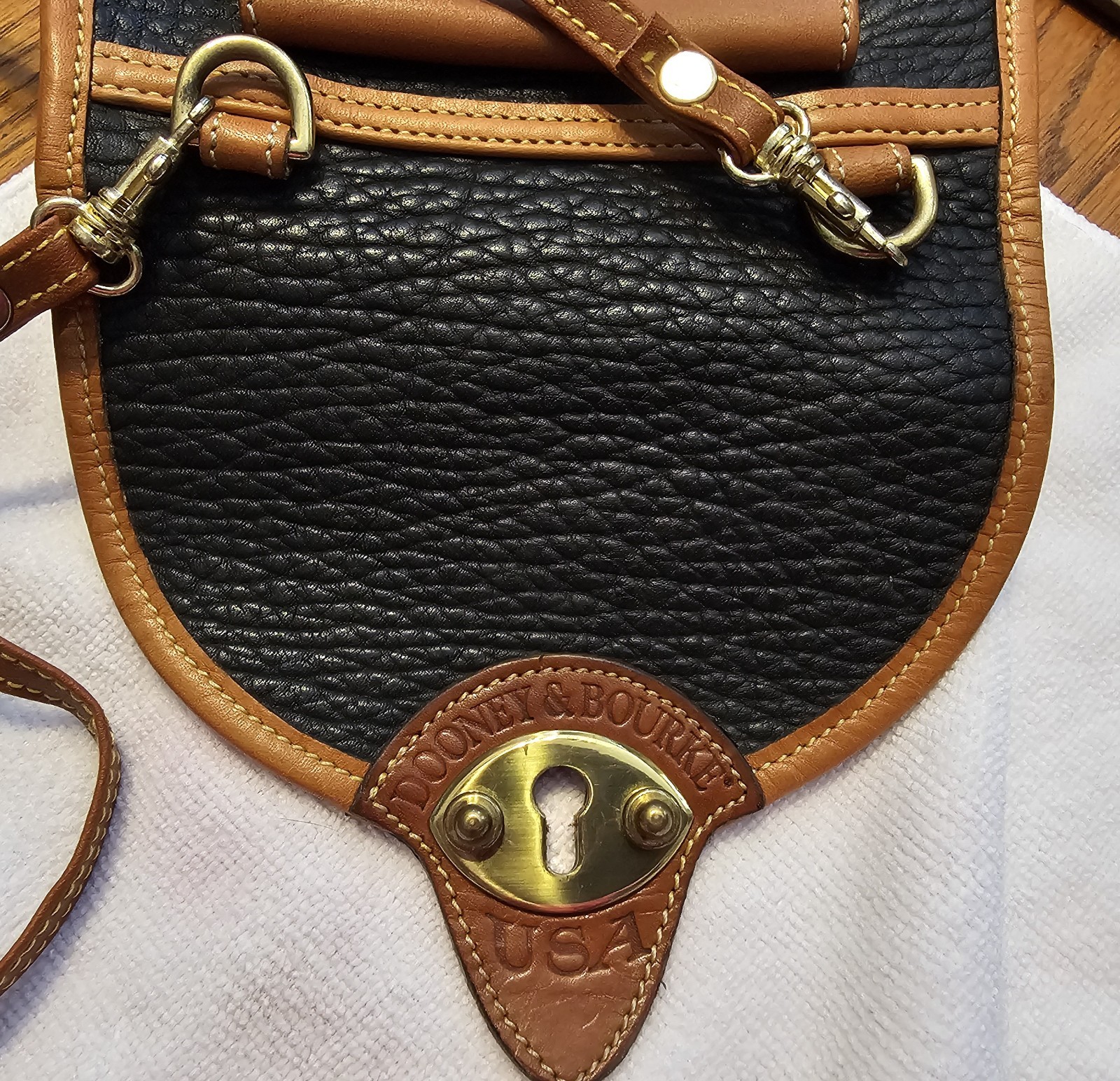 Dooney & Bourke Calvary Black/Brown Crossbody, Gold Hardware Charm.