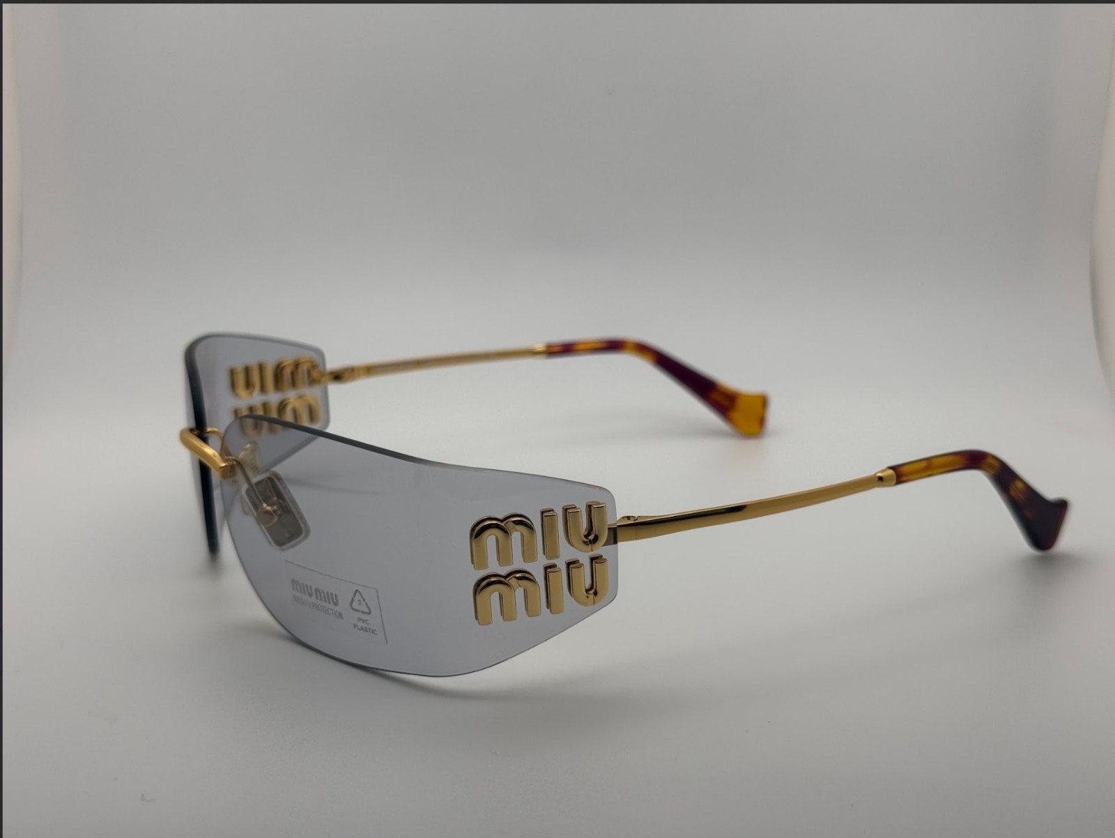 Miu Miu MU A51S Shield Sunglasses Women Gold Rimless Frame Gray Tinted Lens