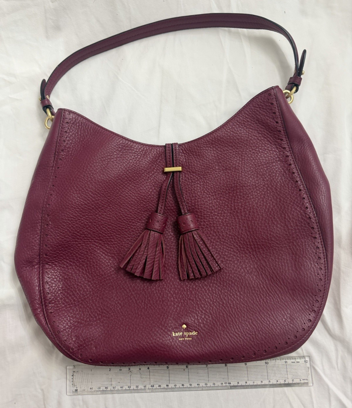 Kate Spade New York Burgundy Pebbled Shoulder Bag Crescent Zip Tassel Gold