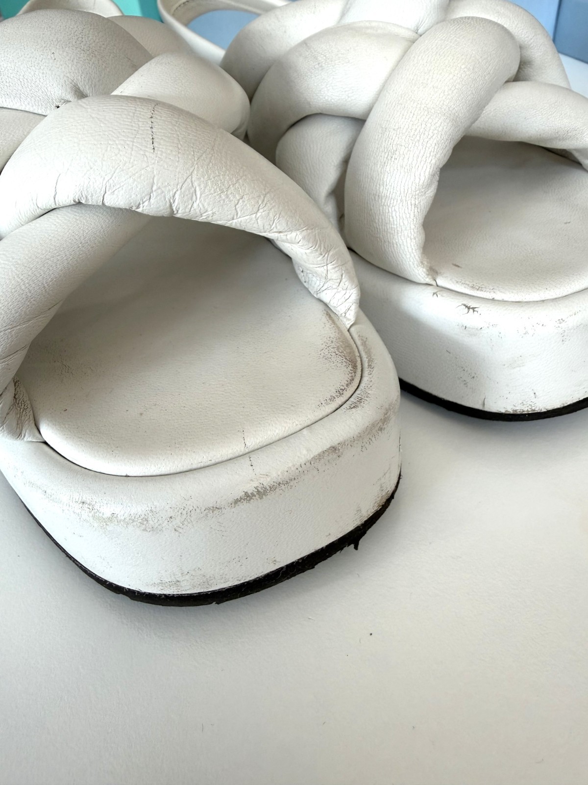 Women’s PRADA Padded Nappa Leather Flatform Sandals in white. Size: 38.5 EU