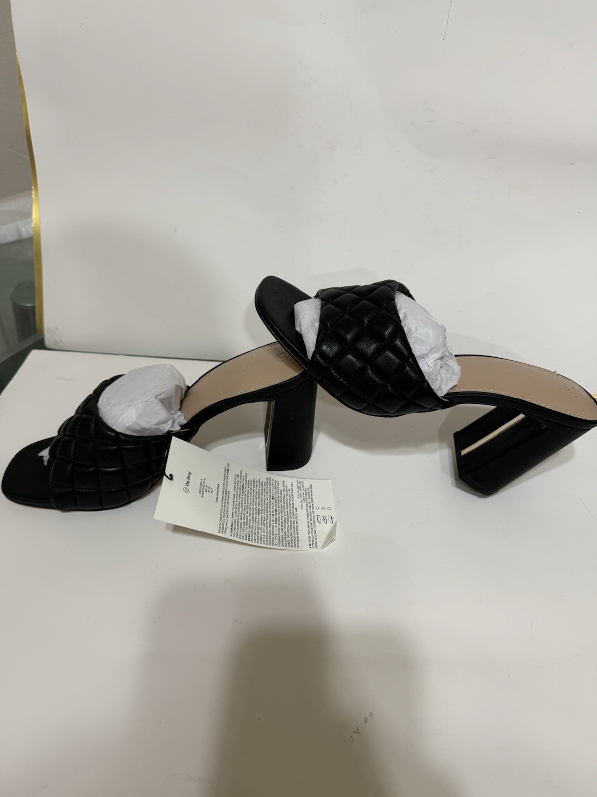 The sandals in the images are the Pattie High Block-Heeled Mule Sandal from