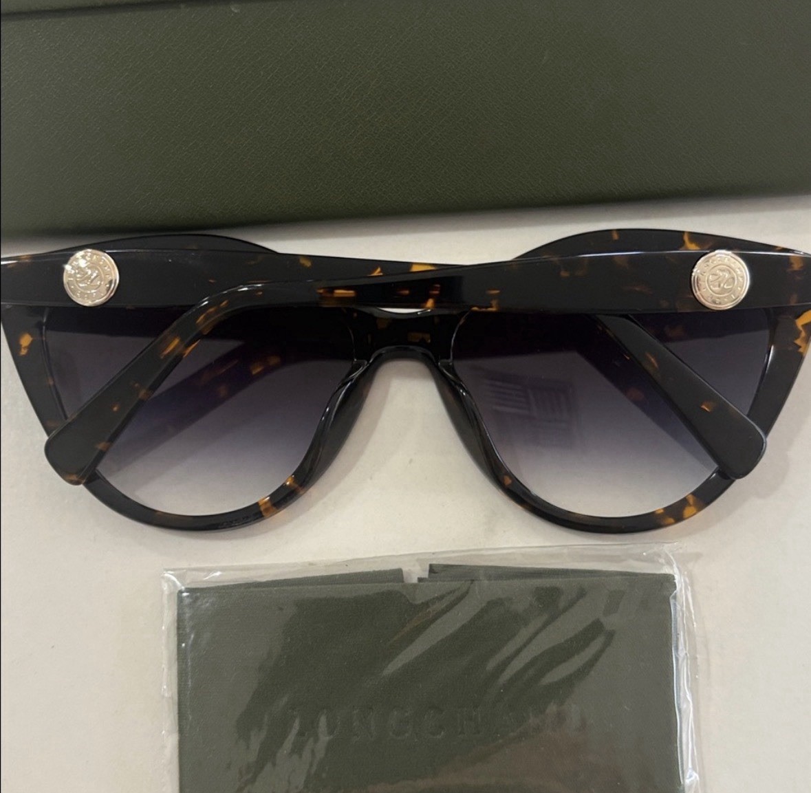 Longchamp Tortoiseshell Cat-Eye Sunglasses with Gradient Black Lenses.