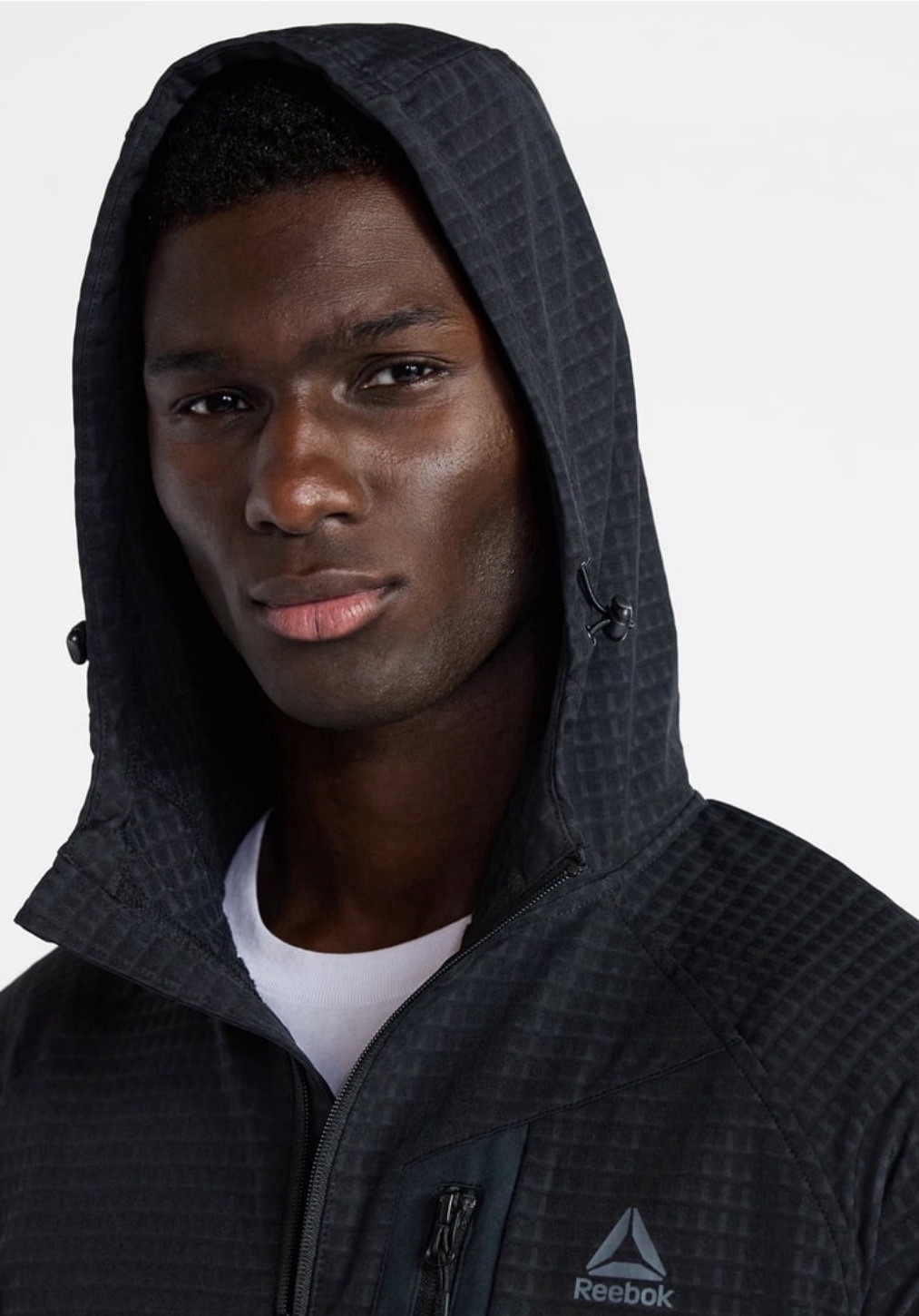 Reebok Men’s Textured Stretch Hooded Jacket, Windbreaker Driftwood Black M-3XL
