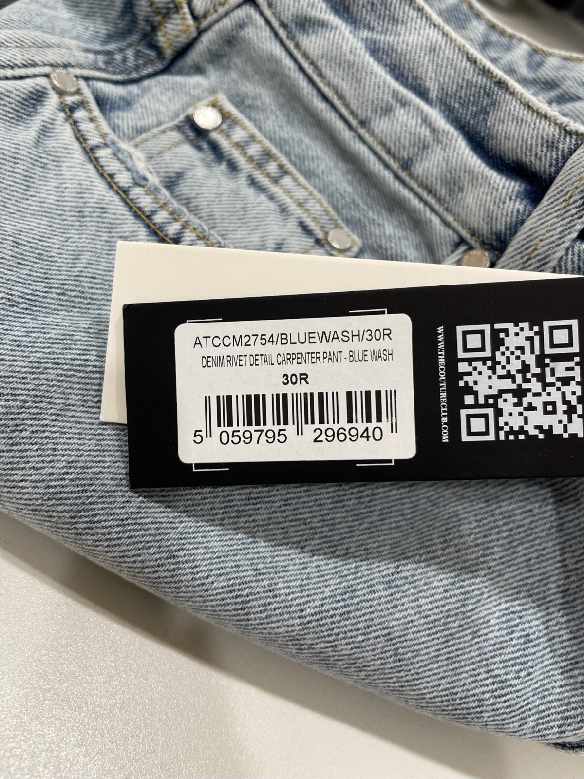 The Couture Club carpenter rivet detail jeans in blue wash 30R