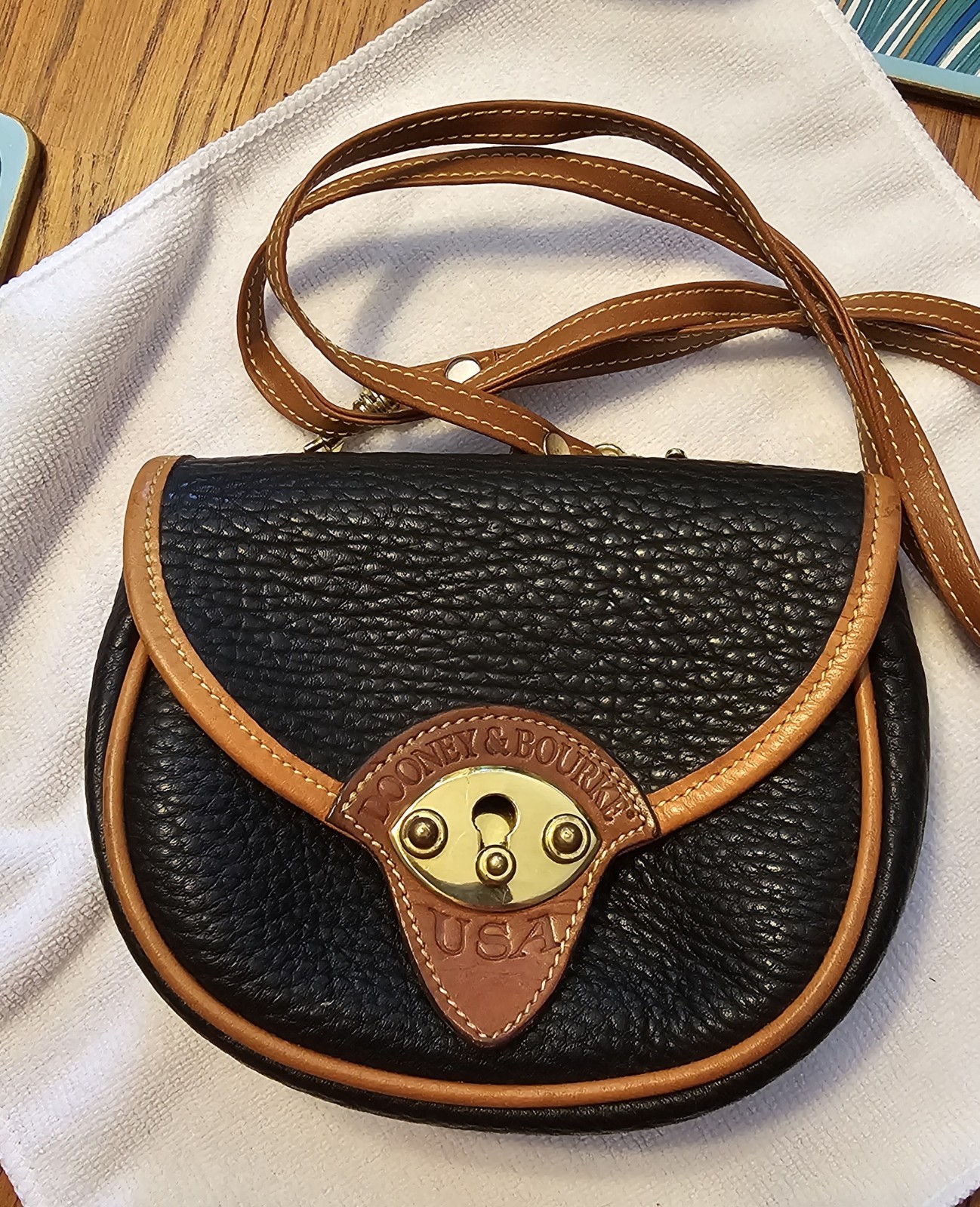 Dooney & Bourke Calvary Black/Brown Crossbody, Gold Hardware Charm.