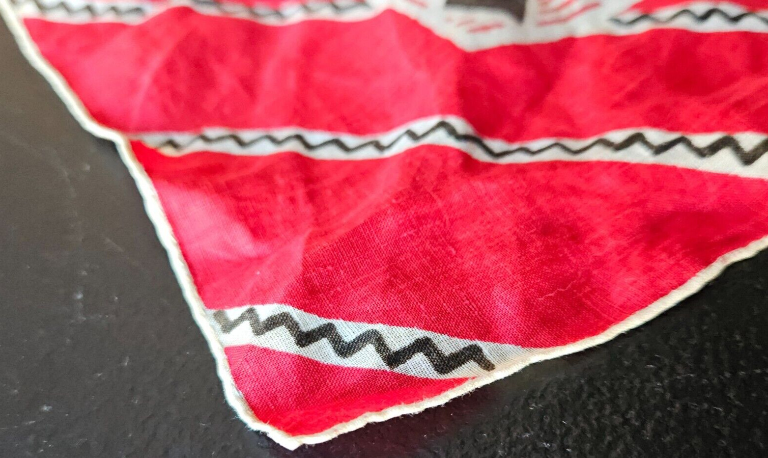 RED, BLACK, WHITE MULTI DESIGN EMBROIDERED EDGE HANDKERCHIEF. 12 1/2 IN.