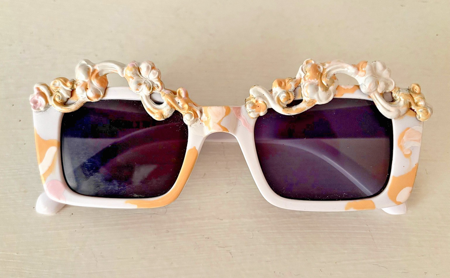 Lacquered Brass Rococo on Plastic Sunglasses 5 3/4″ W x 1 3/4″ H x 6″ arm