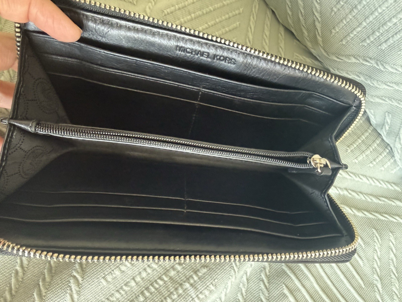 Michael Kors black zip around wallet with gold “Michael Kors Est 1981” Logo