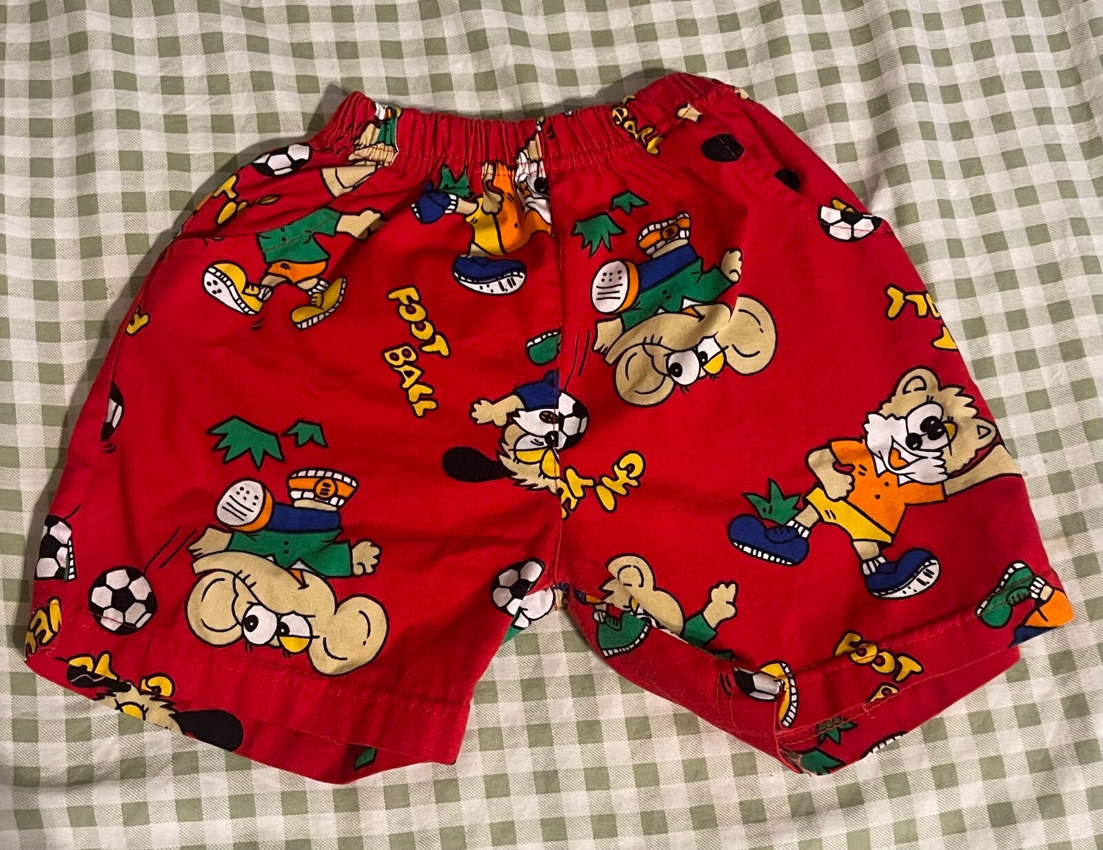 The cutest red vintage boy shorts size 2T has a couple flaws as shown in picture