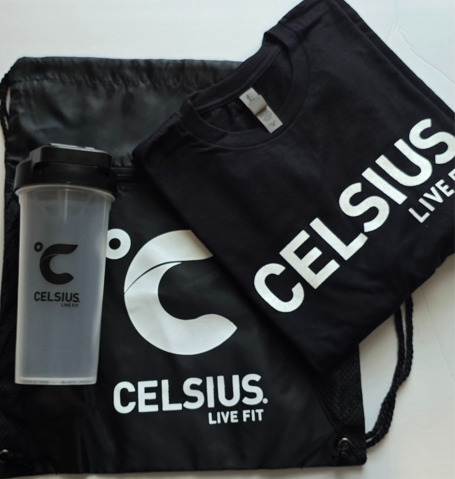 Celsius Live Fit Merch Bundle: T-shirt, Shaker Bottle, and Drawstring Bag
