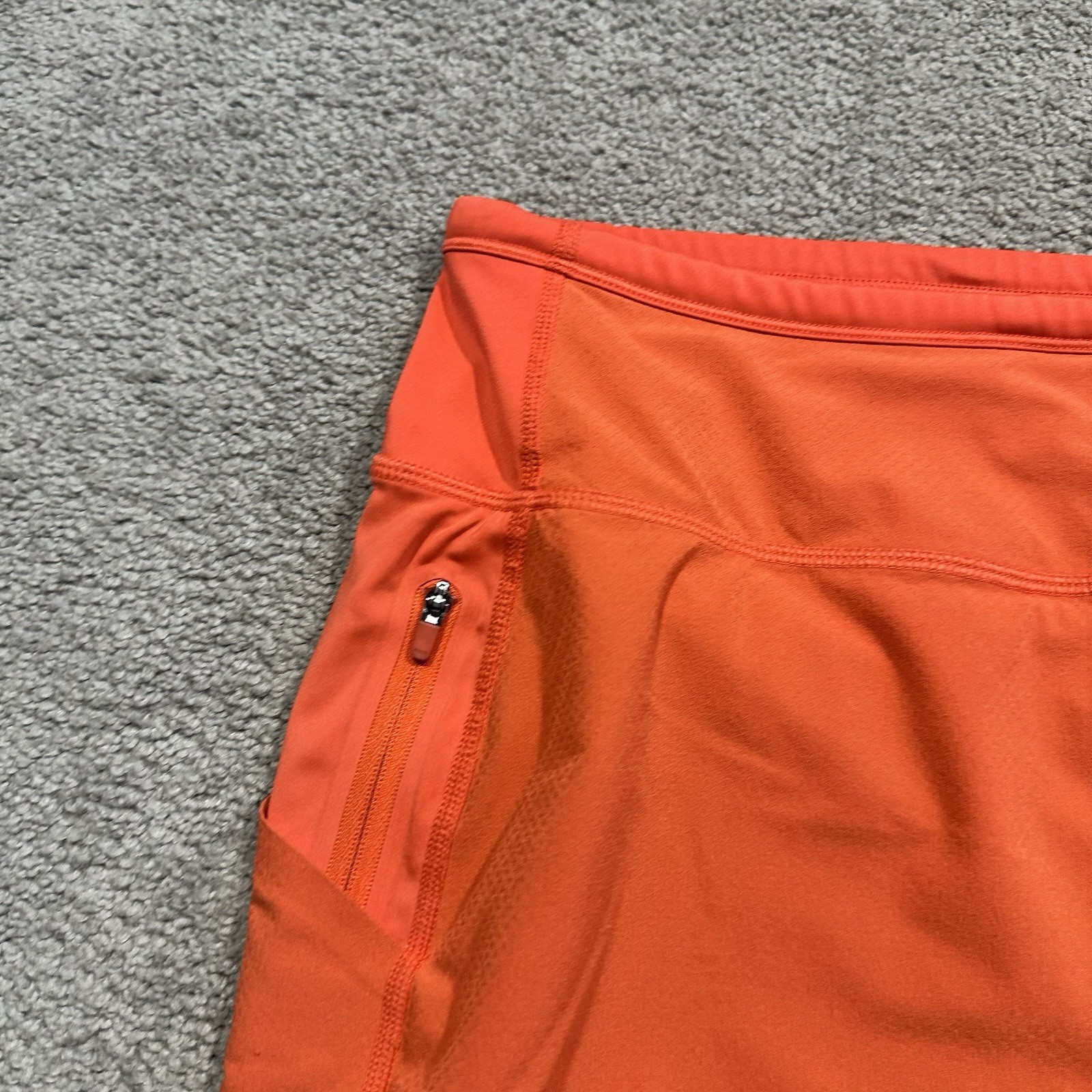 ATHLETA Action Skort in Dobby 14.5 Womens Small Orange Pockets Stretch Athletic