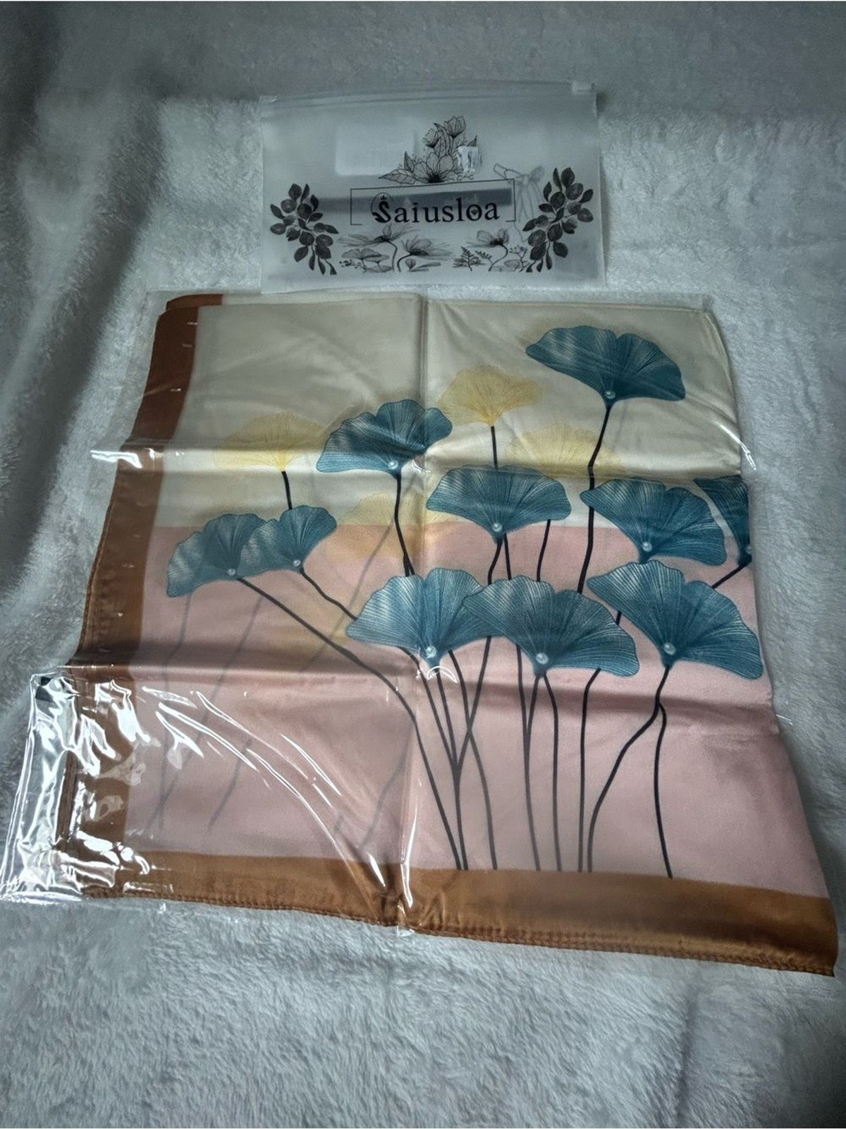 Saiusloa ginkgo leaf scarf designed to provide a “silk-like” feel—smooth,