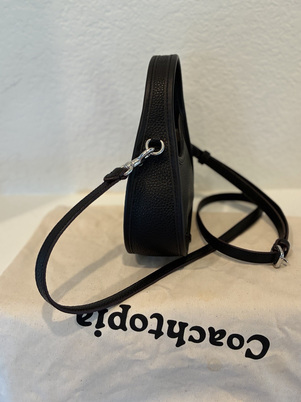 Coachtopia Mini Ergo Bag crafted from black pebbled Coachtopia leather