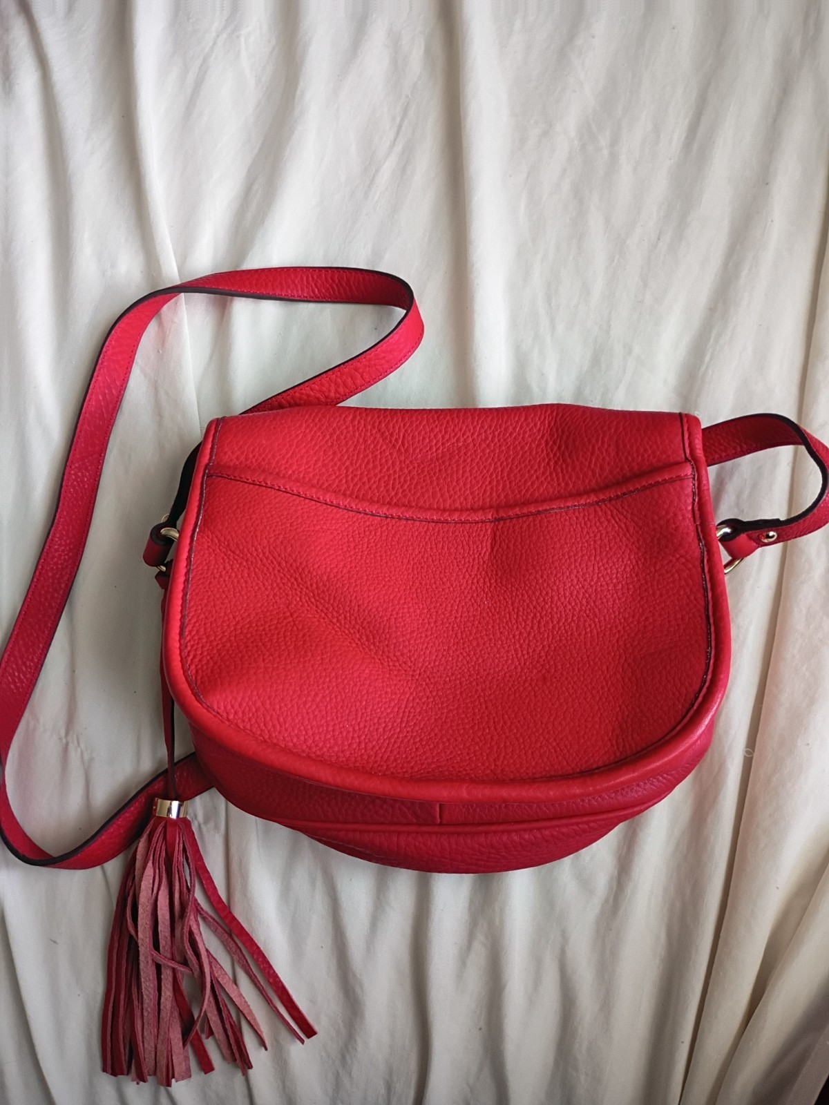 Authentic Isaac Mizrahi Red Pebbled Leather Crossbody Saddle Bag with Tassel