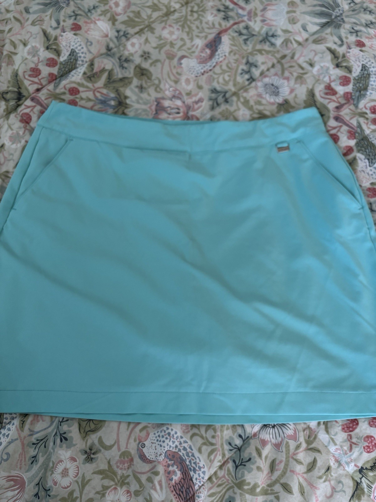 Womens Skorts (4). White, turquoise, tan and yellow. Size 12.