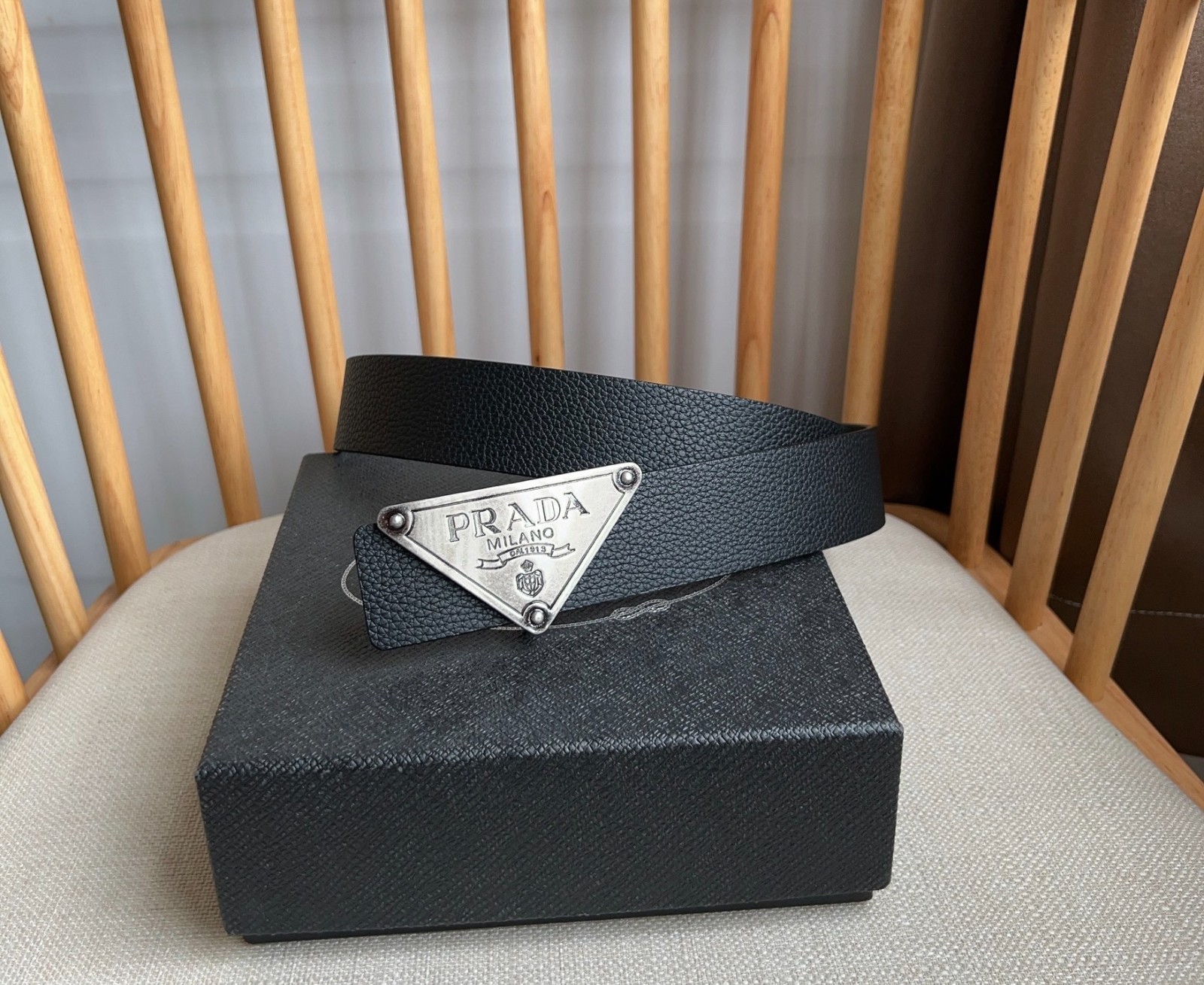 Prada men’s silver-button black leather belt