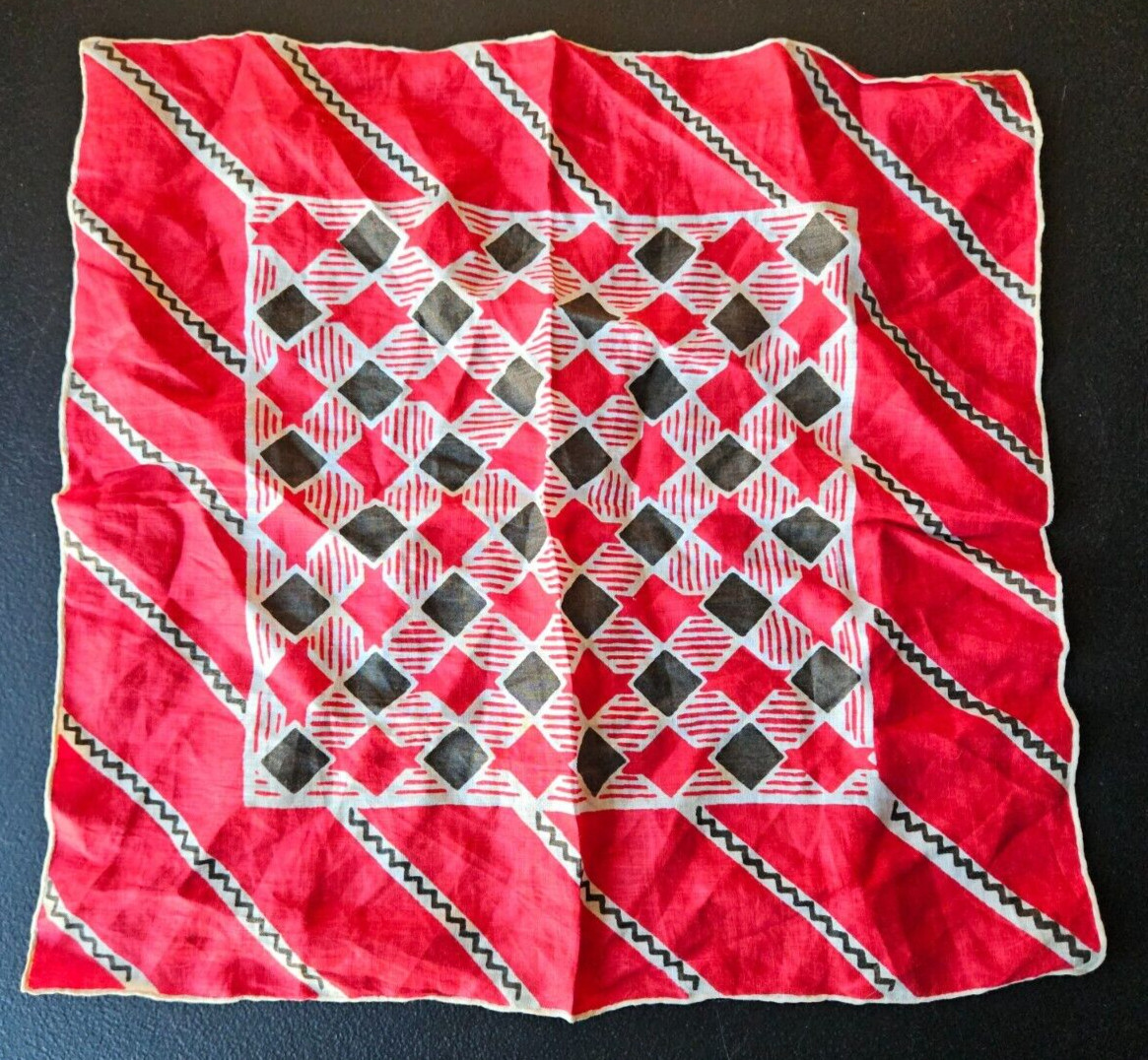 RED, BLACK, WHITE MULTI DESIGN EMBROIDERED EDGE HANDKERCHIEF. 12 1/2 IN.