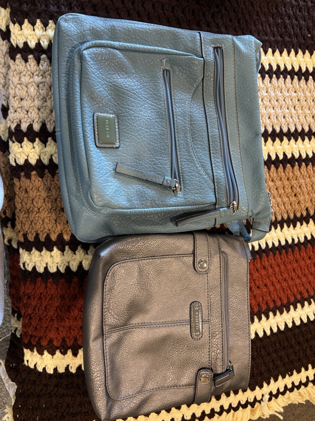 Lot of 2 Blue & Gray Rosetti Crossbody Bags, lighter blue w tear shown. AS IS