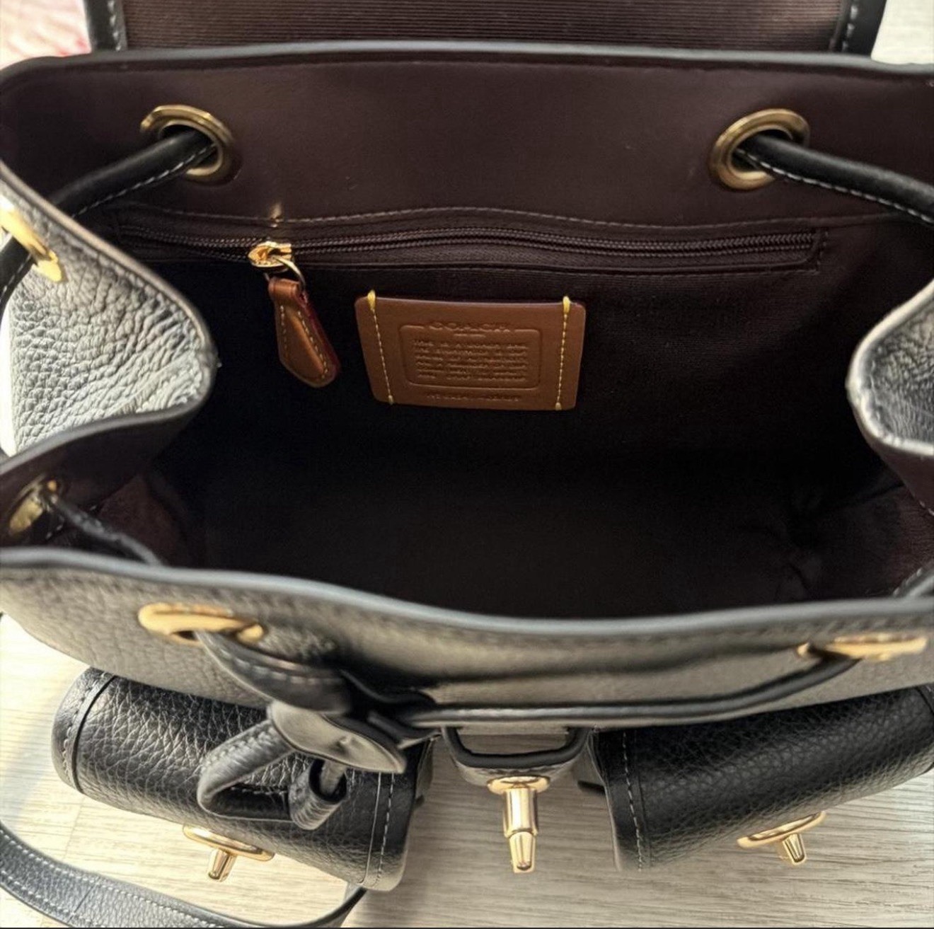 Coach Black Pebbled Turn Lock Drawstring Small Backpack Gold Hardware Hangtag