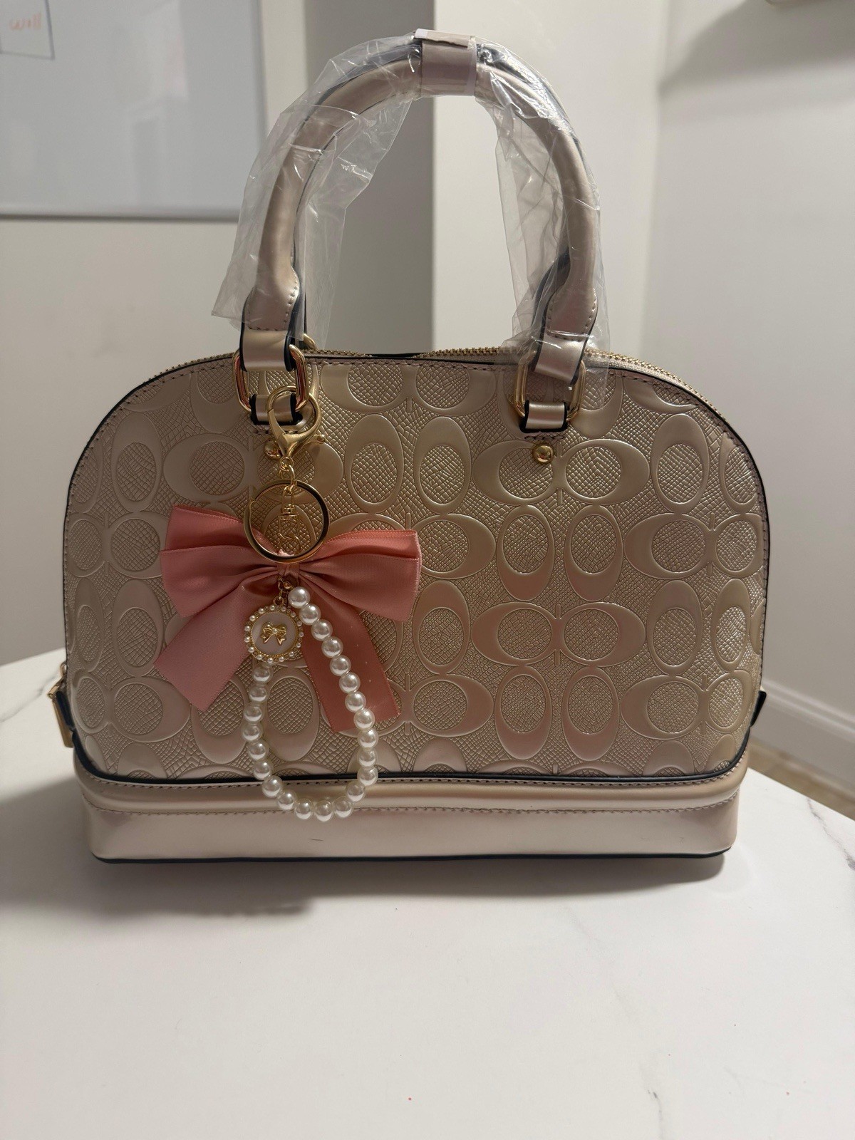 Beige Logo Satchel Top Handle Bag, Zip Closure, Bow Charm, Wristlet, Gold HW