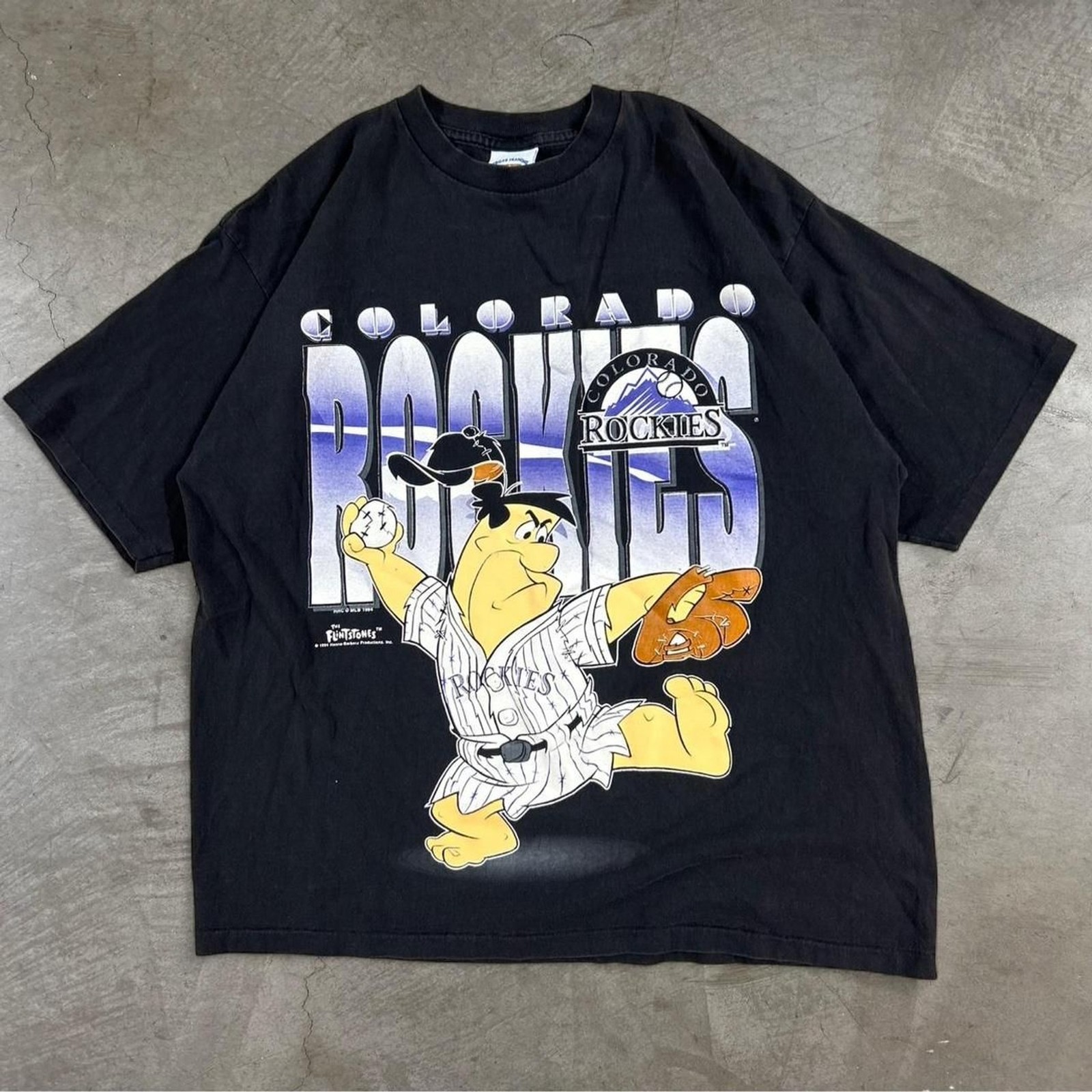 Vintage 90s Colorado Rockies baseball tee with cartoon Flintstones baseball