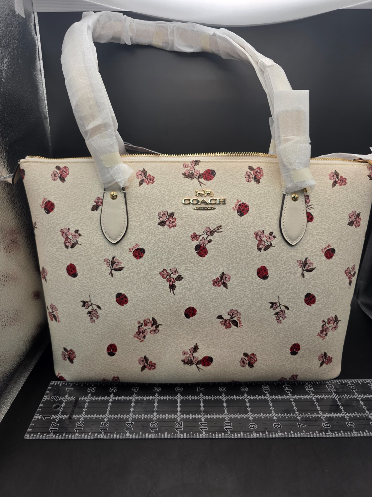 NEW COACH GALLERY TOTE WITH LADYBUG FLORAL PRINT (SCUFF MARKS BACK)